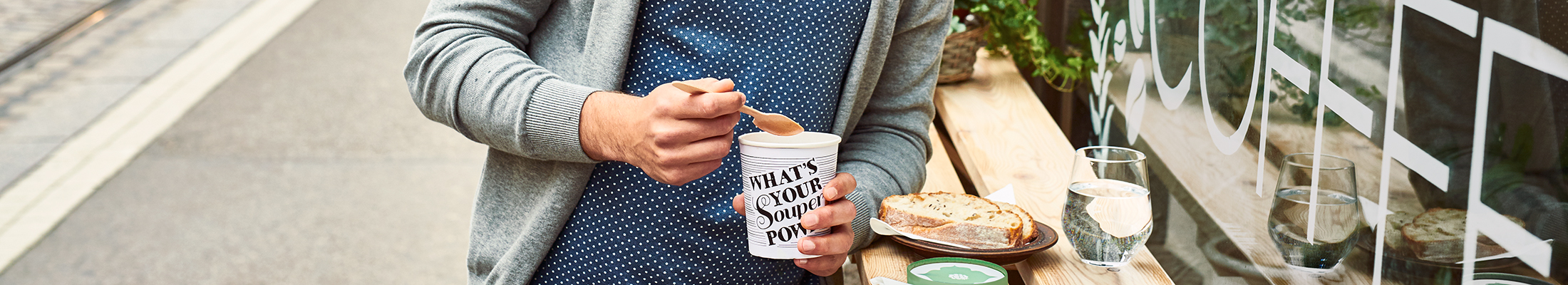 Man with disposable coffee cup