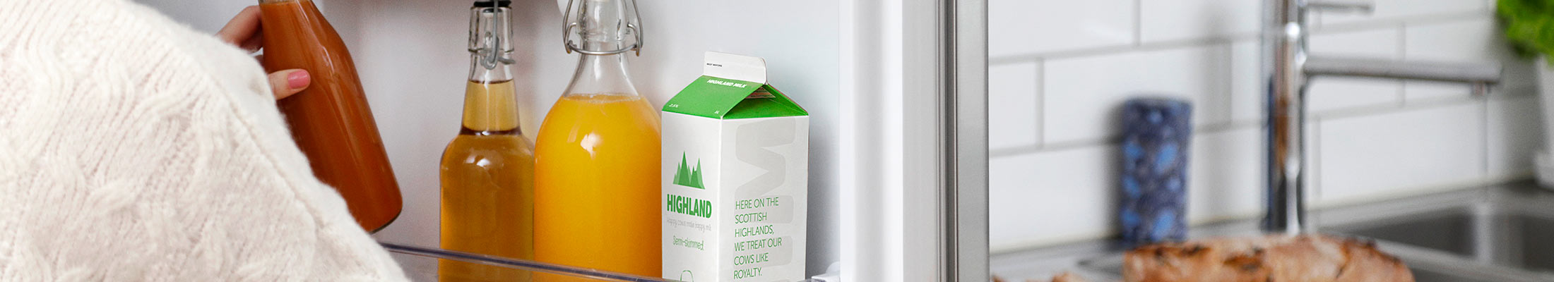 Liquid packaging in an open fridge.