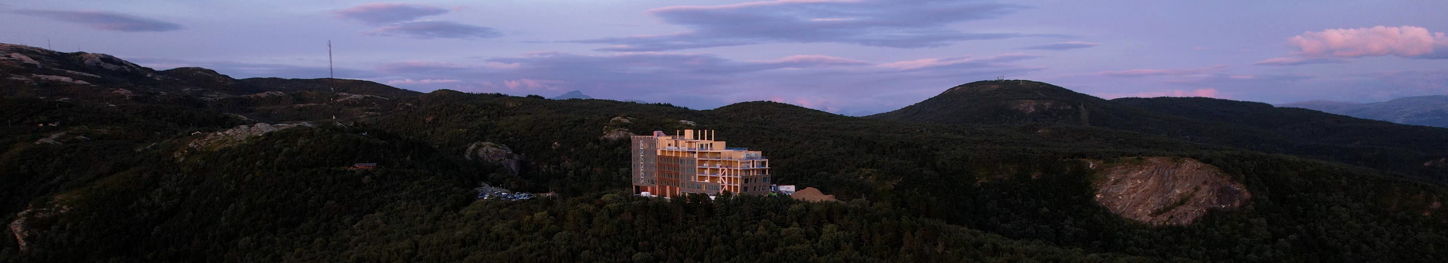 Wooden hotel on top of a hill