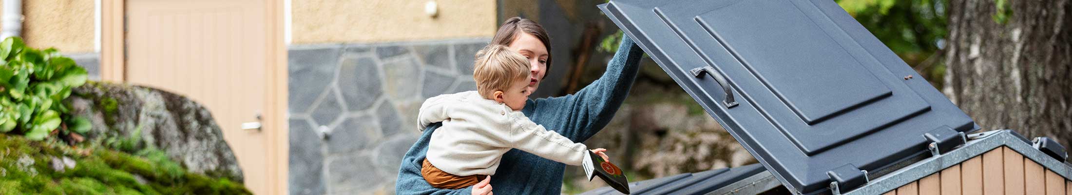 Woman and child recycling