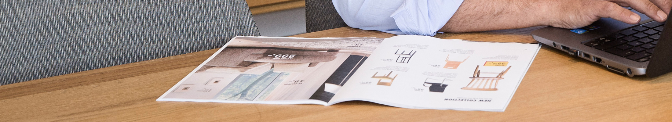 Man reading magazine on table