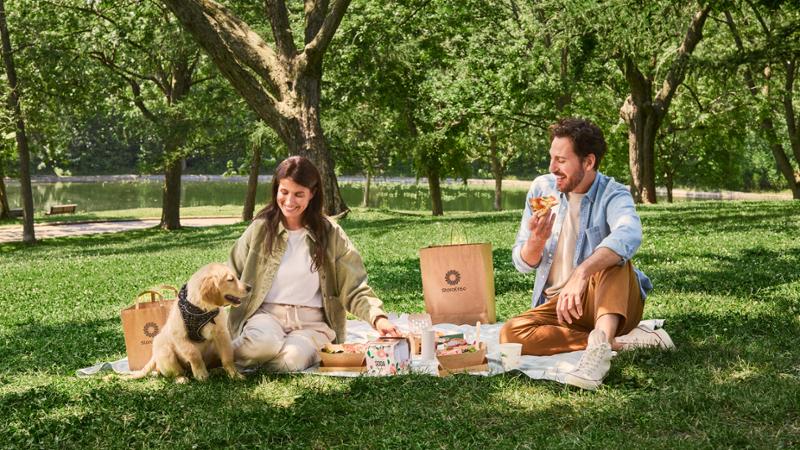 A couple having a picnic on the grass
