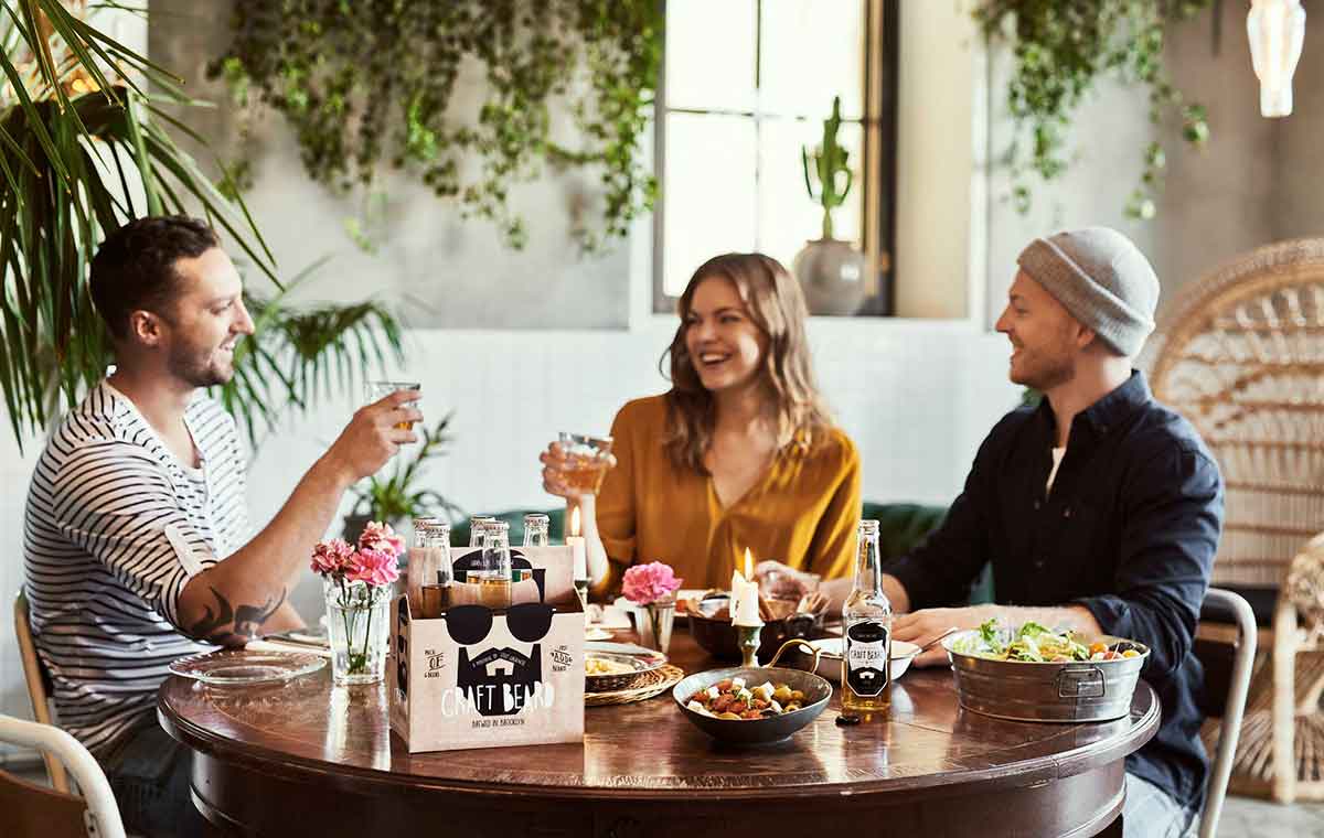 People by a table eating